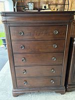 Front view showing six drawers and hardware