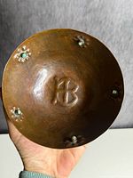 Interior of bowl showing HB monogram and turquoise cabochons