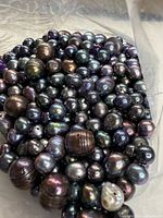 Loose black pearls varying sizes and finishes