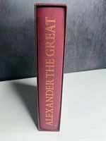 Maroon cloth slipcase spine showing title in gilt