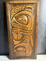 Front view of carved cedar plaque