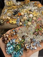 Mixed pile of costume jewelry showing variety of pieces and materials