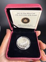 Coin in open RCM case with certificate visible