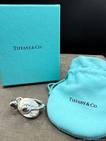 Key ring, pouch and box together