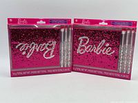 Front view showing two sealed Barbie eyeshadow palette kits with brushes