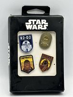 Front of boxed Star Wars enamel pin set showing four pins