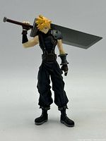 Front view of Cloud Strife figure holding Buster Sword