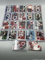 All 22 jersey cards laid out to show quantity, teams and screw-down cases