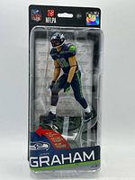 Front of sealed package showing Jimmy Graham figure and branding