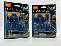 Front view of both sealed Skyfire Exosuit sets in packaging