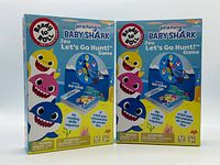 Front view of two boxed Pinkfong Baby Shark Let’s Go Hunt! card games