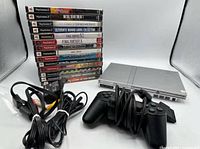 Console, controller, cables, and game stack