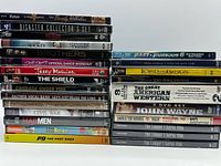 Front view of two stacks showing sealed DVDs and single Blu-ray