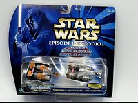 Front of sealed Podracer Pack 2 showing two mini vehicles and branding