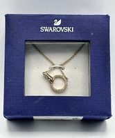 Closed Swarovski box showing necklace through window