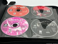 First binder page with PS1 discs Contender, Clock Tower, Gauntlet Legends, Syphon Filter 3