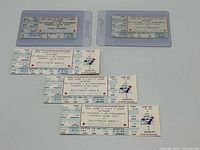 Overview showing six Blue Jays tickets, two in plastic sleeves, four loose