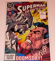 Front cover of Superman The Man of Steel #19 in bag showing Doomsday vs Superman