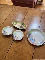 Overview of seven porcelain pieces on table