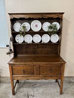 Front view of entire oak hutch with shelves and drawers
