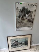 Two framed Bernard Gantner prints leaning against wall