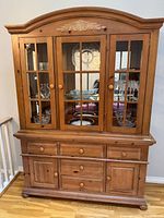 Full view of Broyhill china cabinet showing upper glass doors, lower drawers and doors