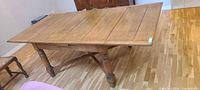 Top view of rectangular oak dining table fully extended