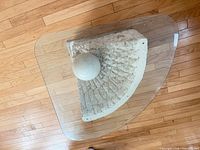 Top view showing glass shape and stone base with sphere