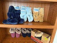 Shelf view showing top and bottom rows of slippers