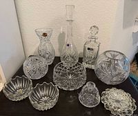 Group shot showing all cut-glass pieces on tabletop