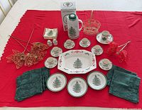 Overview of entire lot arranged on red cloth showing all listed items