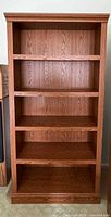 Front view of full bookcase showing all shelves and finish