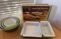 Complete lot showing bakeware box, three bakeware pieces and stacked mixing bowls