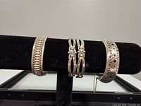 Front view showing all three sterling bracelets on display bar
