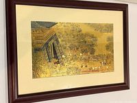 Front angled view of framed metal relief artwork