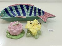 Fish dish with both flower shakers displayed