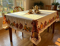 Tablecloth displayed on dining table showing overall pattern and drape