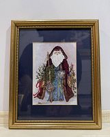 Front view of framed and matted Santa print