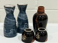 Group shot of three carafes and two cups