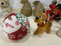 Plush Pluto, quilted ball, gold pear ornaments visible