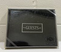 Front view of boxed guest book showing cover text and HBH logo
