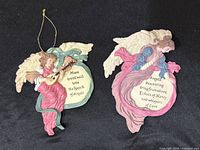 Both angel plaques front view