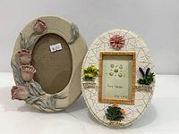 Both oval decorative photo frames side by side