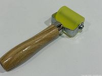 Full view Alethron 48mm yellow rubber roller with wood handle