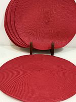Stack and display of red round placemats