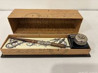 Full set inside decorative box showing pen, inkwell, holder