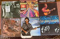 Six LP album covers laid out: Hooters One Way Home, Hollies Another Night, Gordon Lightfoot The Best Of, Gerry Rafferty Night Owl, George Harrison Cloud Nine, Fine Young Cannibals