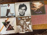 Five LP records laid out showing front jackets