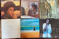 Six LP record jackets laid out showing front covers