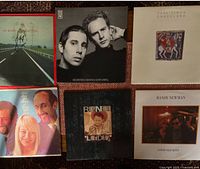 Six of the LP album covers laid out: Pat Metheny, Simon & Garfunkel, Paul Simon, Procol Harum, Randy Newman (2)